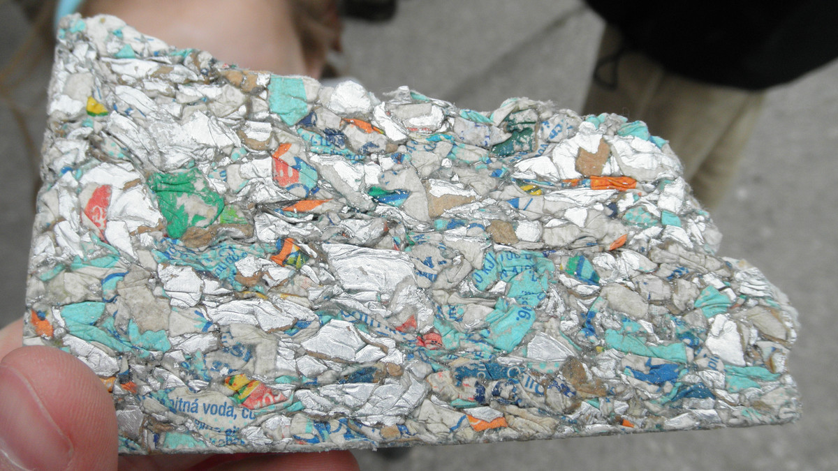 Close-up of building board pressed from recycled beverage cartons.