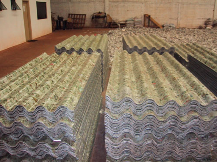 Stacks of corrugated roof sheets made from recycled beverage-carton material
